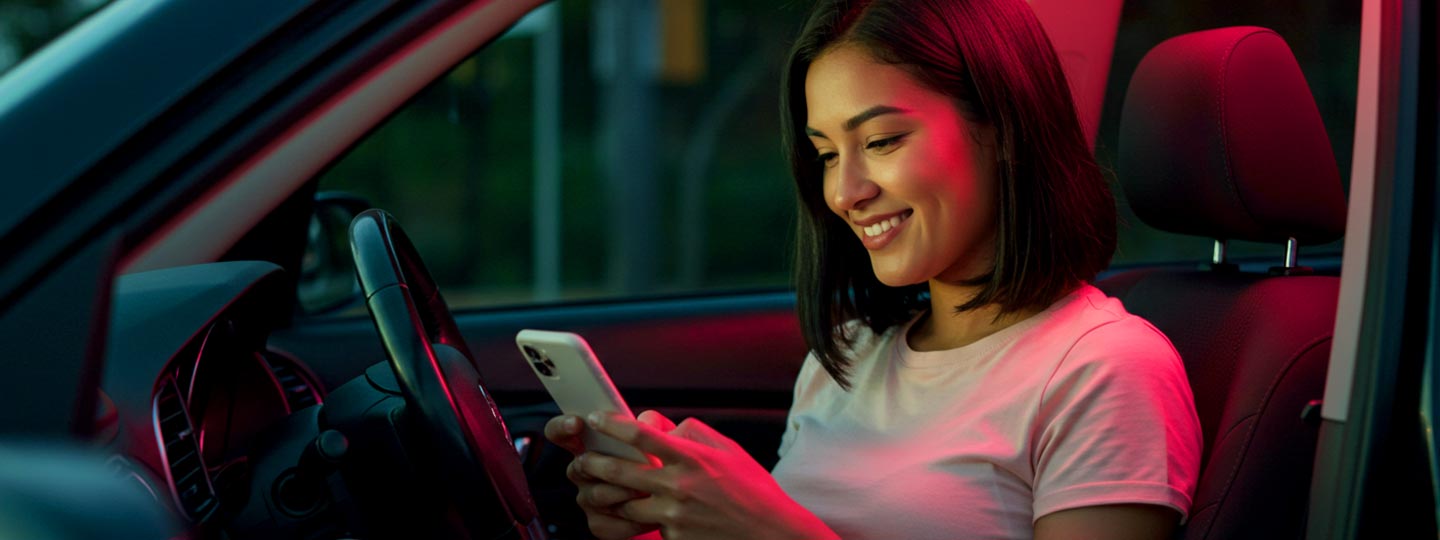 Girl using phone and driving