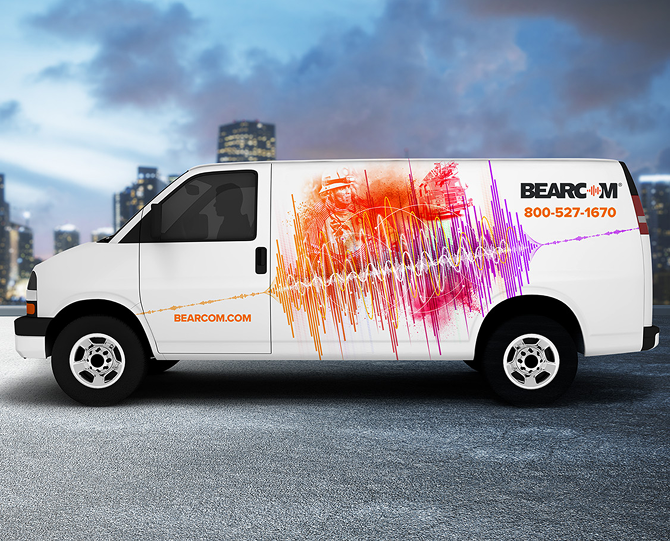 BearCom service van with a colorful sound-wave vehicle wrap