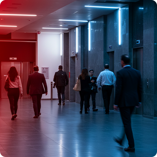 People walking through a modern office building lobby