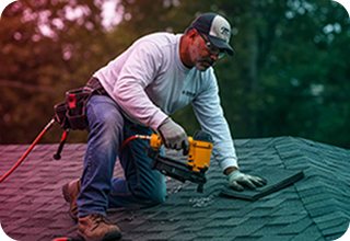 Man with roofing machine