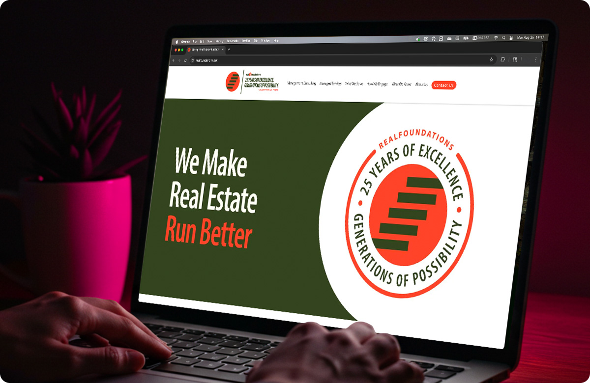 RealFoundations homepage on a laptop screen